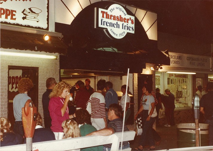 Thrasher's storefront old photo with a line out front