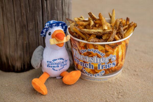 Stuffed seagull next to a bucket of Thrasher's French Fries